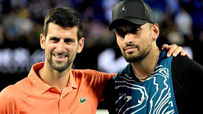 Serbia's Novak Djokovic (L) and Australia's Nick Kyrgios pose for pictures during their Arena Showdown charity match ahead of the Australian Open tennis tournament in Melbourne on January 13, 2023. (Photo by WILLIAM WEST / AFP)