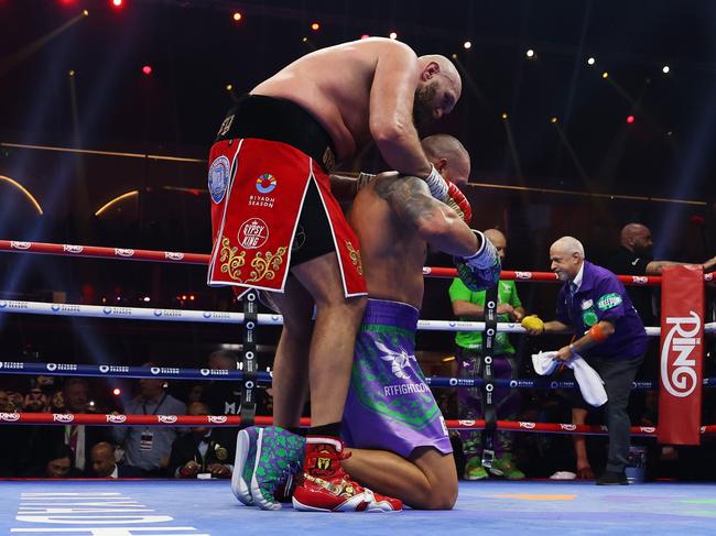 RIYADH, SAUDI ARABIA - DECEMBER 21: Tyson Fury and Oleksandr Usyk embrace following the IBF, IBO, WBA, WBC and WBO Undisputed World Heavyweight titles' fight between Oleksandr Usyk and Tyson Fury as part of Oleksandr Usyk v Tyson Fury 2, Reignited card at Kingdom Arena on December 21, 2024 in Riyadh, Saudi Arabia. (Photo by Richard Pelham/Getty Images)