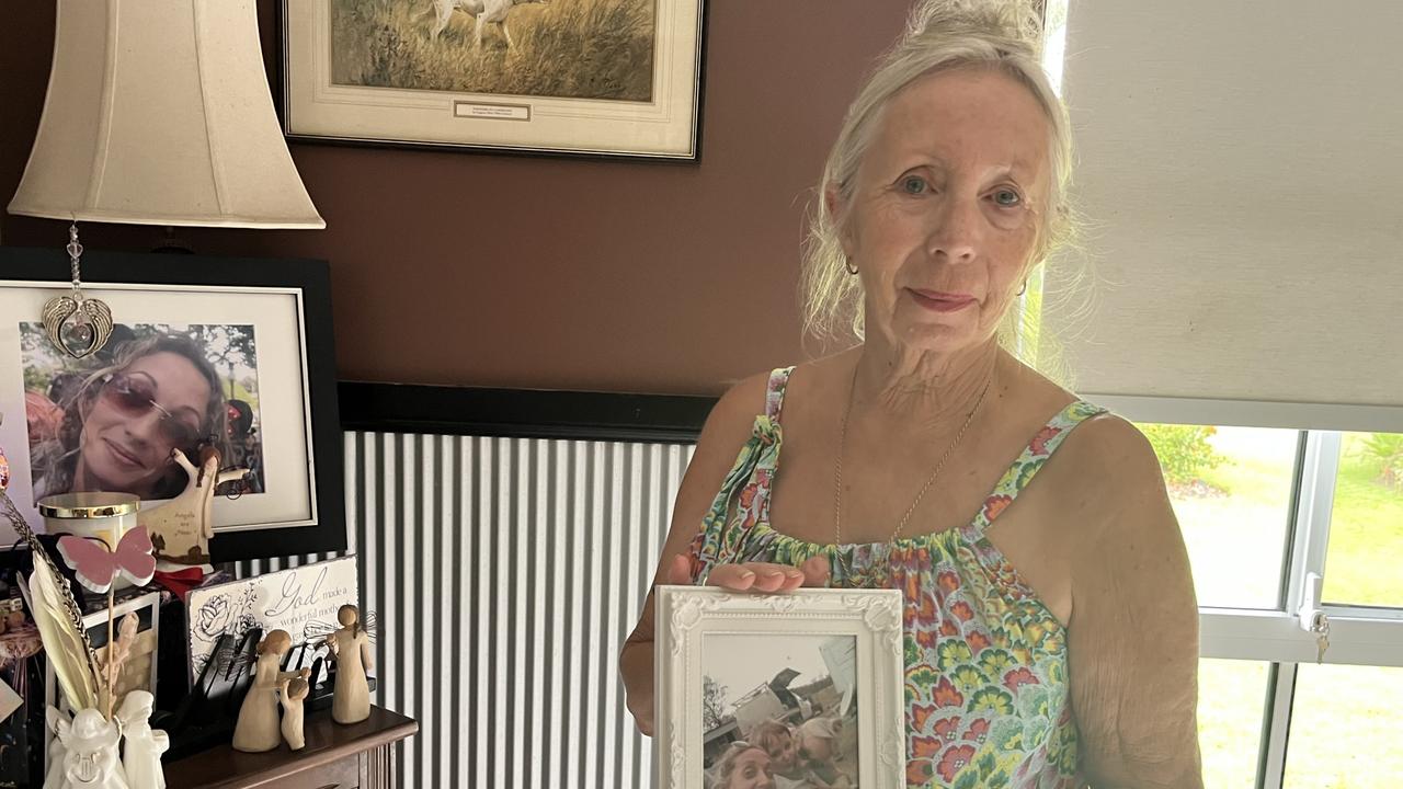 Sandra McGrath with the memorial for her daughter Vicky, set up in her Bidwill home.