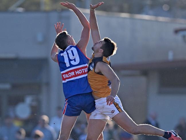 EDFL: Keilor’s Blair Wyllie and Strathmore’s Andrew Vavra jump in the ruck. Picture: Andy Brownbill