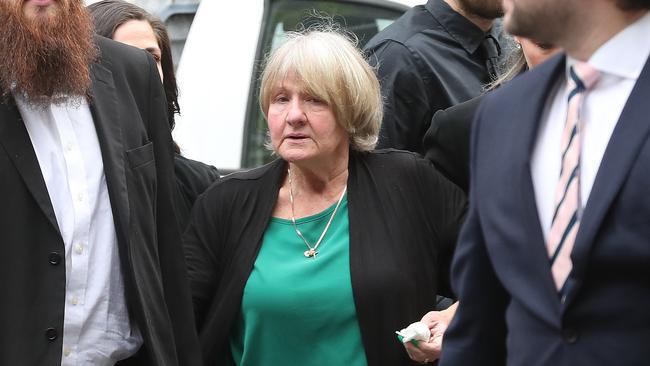 Ms Amorosi’s mother Joyleen Robinson is supported outside court. Picture: David Crosling