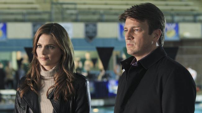 Working on Castle requires sacrifices ... TV show’s star Nathan Fillion with co-star Stana Katic (Kate Beckett). Picture: ABC / Matt Kennedy