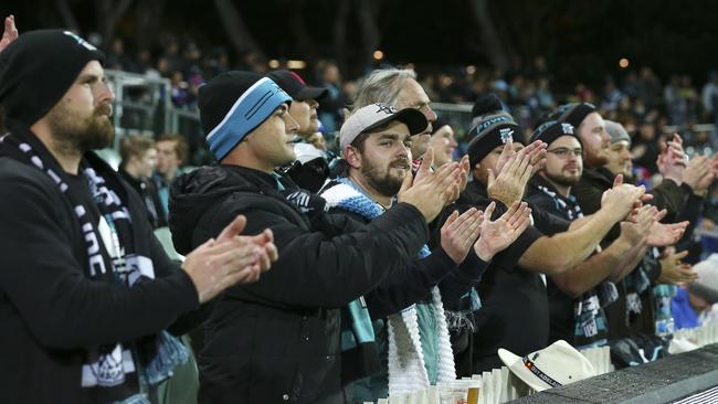 Power fans show their respect and support for Todd Marshall by standing and applauding him at the 13-minute mark of his comeback game against the Western Bulldogs. Picture: Sarah Reed.