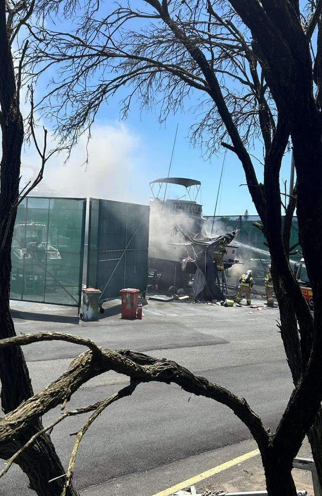 Firefighters battle a boat blaze on a dry dock in Buddina, on the Sunshine Coast. Picture: Contributed