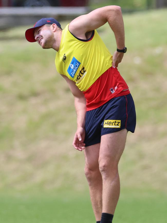 Demons in Lorne: Steven May stretches his back. Picture: Brendan Beckett