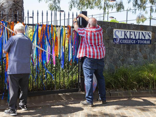 Ribbons are tied to the gates at St Kevin’s College to support victims of child sexual abuse. Picture: Sarah Matray