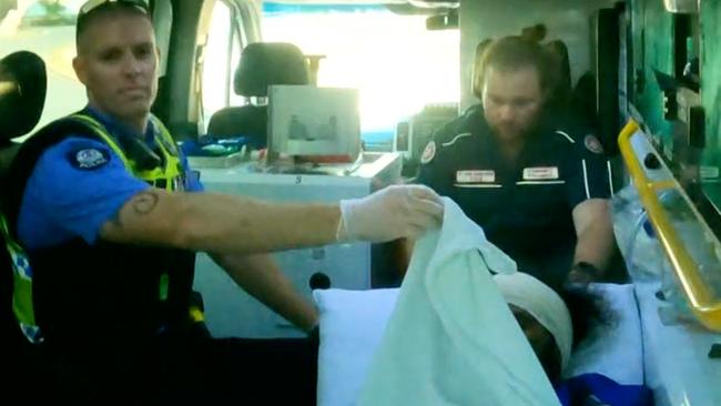 Cleo Smith’s alleged abductor in the back of an ambulance with police. Picture Simon Hydzik/7NEWS