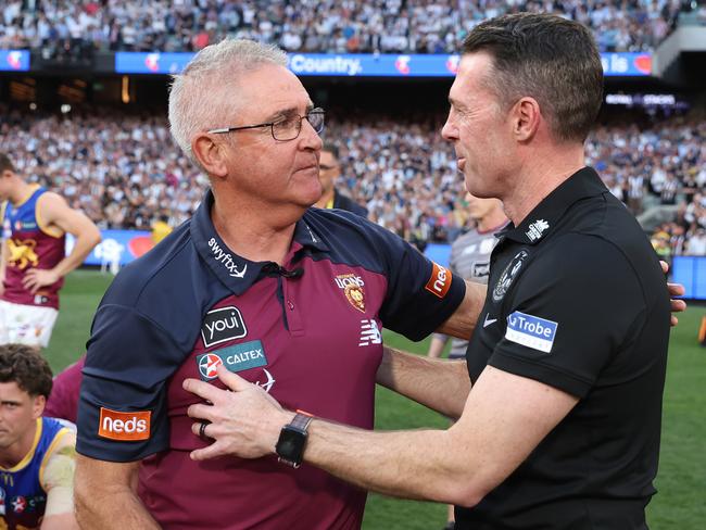 MELBOURNE, AUSTRALIA - SEPTEMBER 30: Lions coach Chris Fagan is acknowledged by Magpies coach Craig McRae during the 2023 AFL Grand Final match between Collingwood Magpies and Brisbane Lions at Melbourne Cricket Ground, on September 30, 2023, in Melbourne, Australia. (Photo by Robert Cianflone/AFL Photos/via Getty Images)