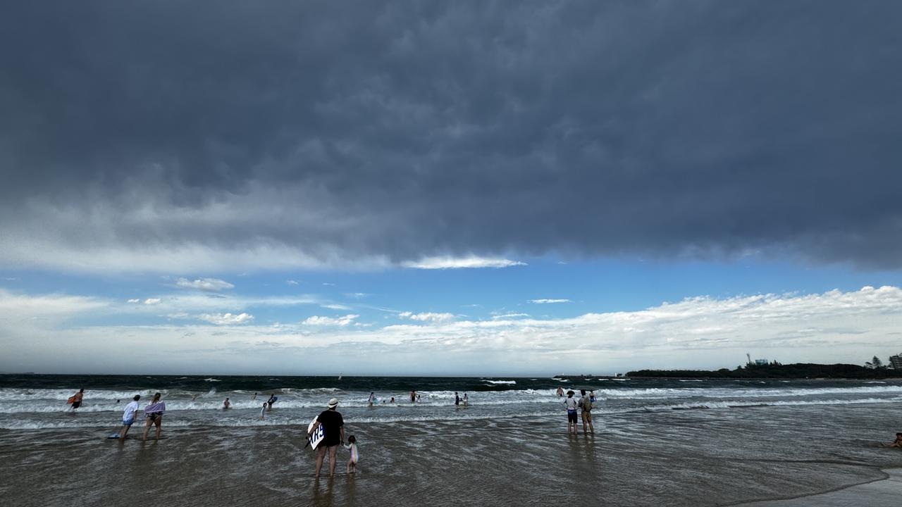 Storm clouds hang over Mooloolaba beach. Photo: Mark Furler