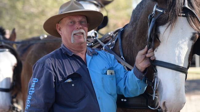 Steve May with Bailey, one of his Clydesdale horses.