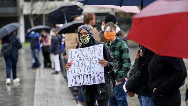 The Black Lives Matter protest in Adelaide in the rain on Saturday. Picture: Mike Burton