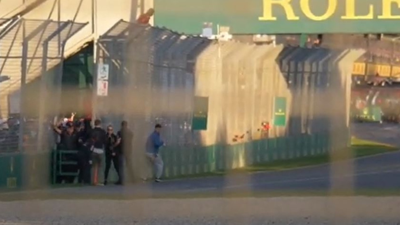 Spectators near turn 1 pour onto the racing circuit as Formula One racers enter the home straight at the other end. Picture: YouTube