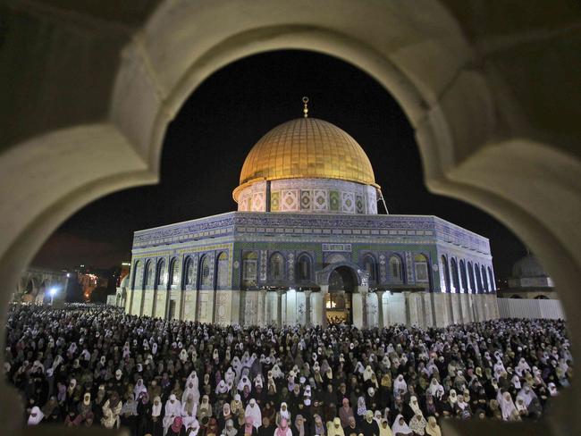 Palestinian Muslim worshipers pray during Laylat Al Qadr, also known as the Night of Power, in front of the Dome of the Rock Mosque, in the Al Aqsa Mosque compound in Jerusalem's Old City, Israel, 05/09/2010. Laylat Al Qadr is marked on the 27th day of the holy fasting month of Ramadan and is commemorated as the night Prophet Muhammad received the first revelation of the Quran. Muslims traditionally spend the night in prayer and devotion.