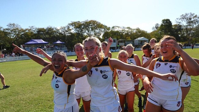 Bond QAFLW development captain Rihannaa Saliadarre (left) celebrates after winning the 2019 grand final. Supplied.