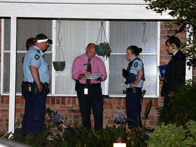 Detectives, police officers and forensic services at Mr Gee’s home. Picture: Bill Hearne