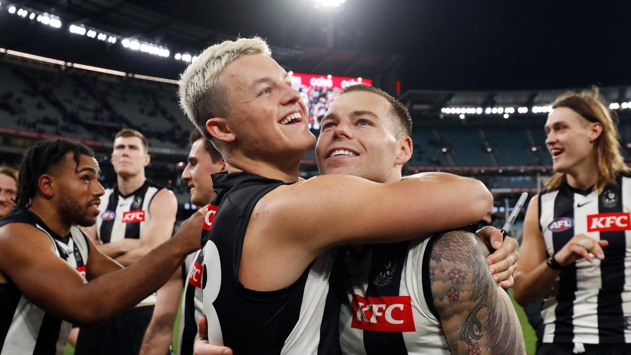 Jack Ginnivan hugs Jamie Elliott. (Photo by Dylan Burns/AFL Photos via Getty Images)