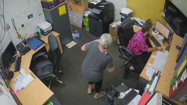 Two staff members hide inside the office of the Katherine Country Club on the early hours of Monday morning. Picture: Supplied