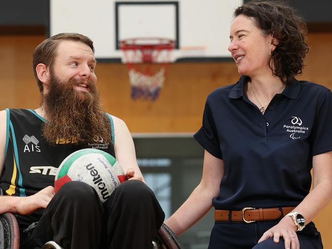 Chief Medical Officer for the Australian Paralympic Team Dr Philippa Inge (correct spelling) with Paralympian wheelchair Rugby player Ben Fawcett on the challenges Paralympians face getting to Tokyo for the games with the added risk of COVID. Dr Philippa and Ben training on the basketball courts at Essendon Football Club.                       Picture: David Caird