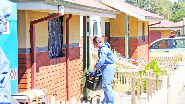 A police forensics specialist investigating the disappearance of Bradley Breward, at a Newnham unit in 2017.