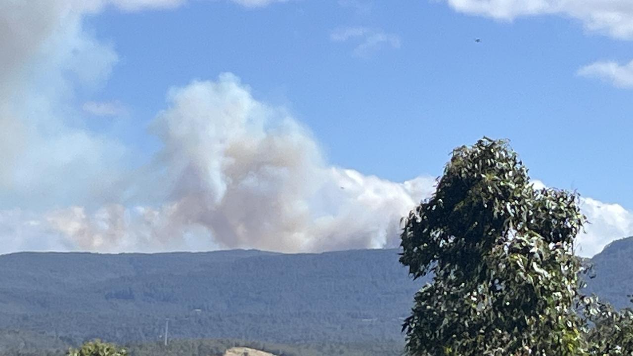 Smoke rises from a bushfire at Snug Tiers and Snug Falls. Taken from Margate