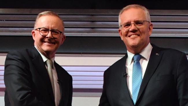 Australian Prime Minister Scott Morrison and Australian Opposition Leader Anthony Albanese shake hands during the third leaders' debate at Seven Network Studios on Day 31 of the 2022 federal election campaign, in Sydney, Wednesday, May 11, 2022. (AAP Image/Mick Tsikas) NO ARCHIVING