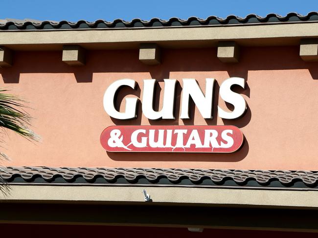 A sign for Guns &amp; Guitars, a gun shop, where suspected Las Vegas gunman Stephen Paddock allegedly purchased firearms. Picture: Getty