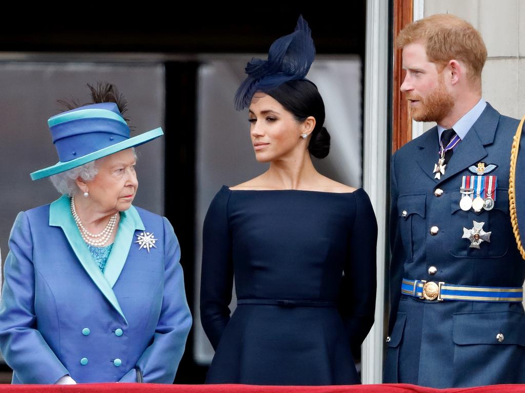 Queen Elizabeth, Meghan, Duchess of Sussex and Prince Harry, Duke of Sussex on the balcony of Buckingham Palace. Picture: Max Mumby/Indigo/Getty Images