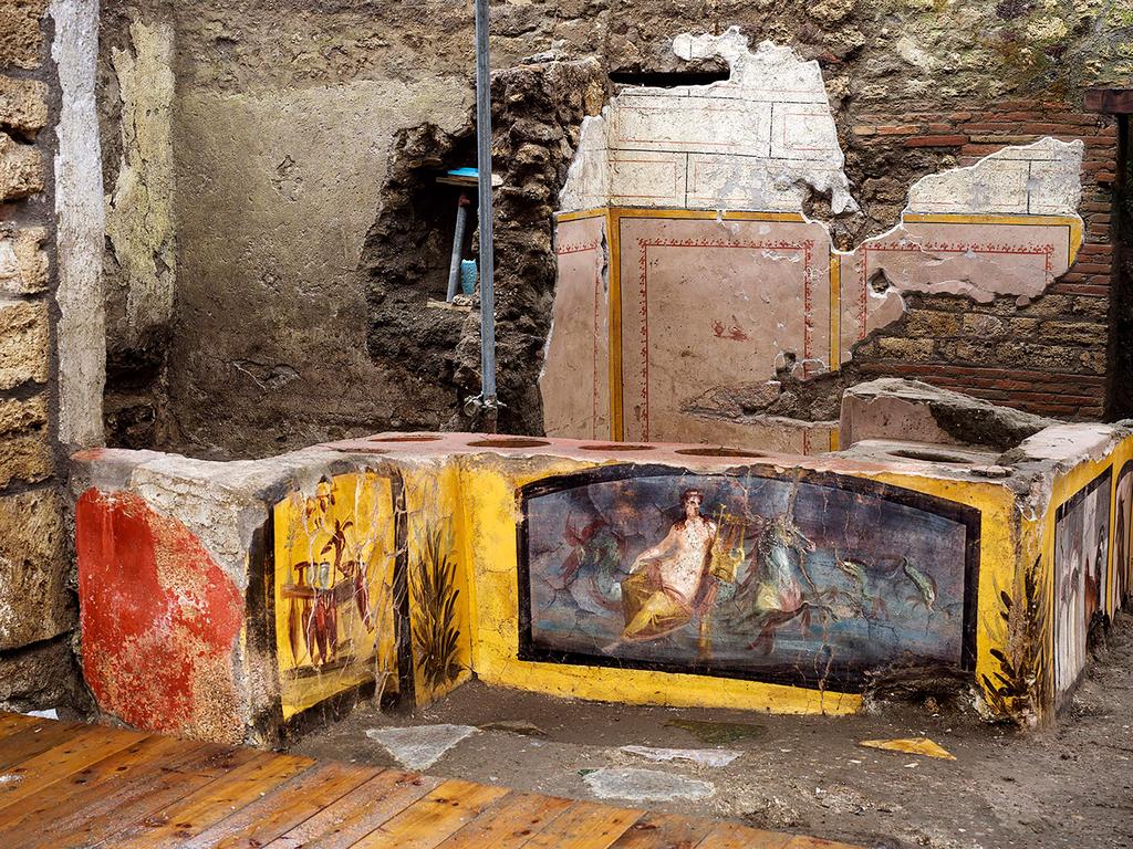 An ancient Roman fast food counter that was unearthed in Pompeii last year will open to the public. Picture: Luigi Spina / AFP