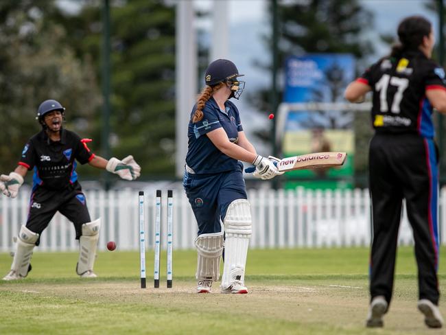 The moment: Natalia Egan takes the prize wicket of Manly’s Charlotte Allen. Picture: Julian Andrews