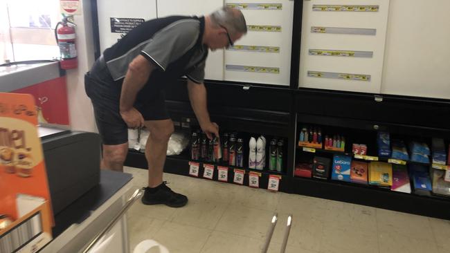 Windaroo IGA owner Peter Watson keeps the cans of Rexona deodorant behind the counter. PHOTO: JUDITH KERR 