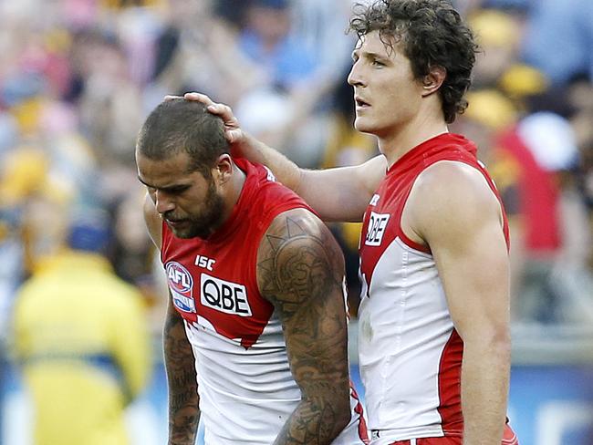 Kurt Tippett consoles Lance Franklin after the 2014 Grand Final loss. Picture: David Caird