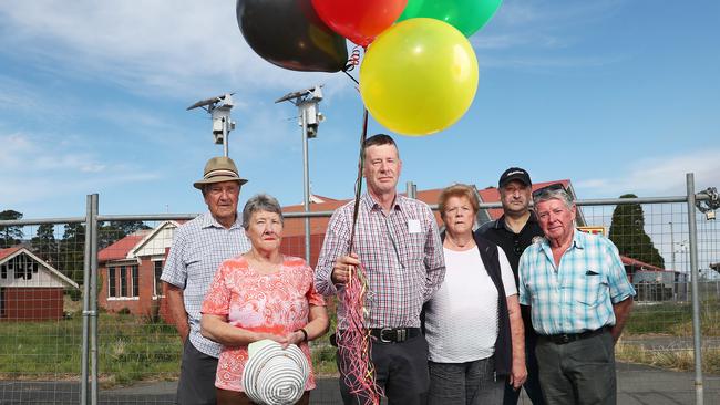 L-R Neil Morrison, Jenny Ploughman, Paul Campton, Mary Moles, Shane Alderton, Marty Watkins some of the residents concerned about proposed plans for redevelopment of the old Claremont Primary School site, with balloons to show the height of the proposed development. Picture: Nikki Davis-Jones