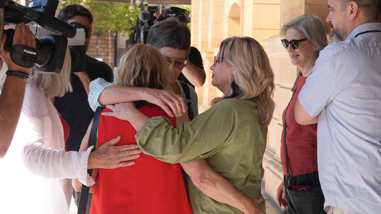 Supporters outside the District Court after killer drink-driving lawyer Lauren Jean Willgoose, received a head sentence of 8 years. A sad Christine Walsh, wife of the victim, Tony Walsh, hugged by family and friends. Picture: NewsWire / Dean Martin