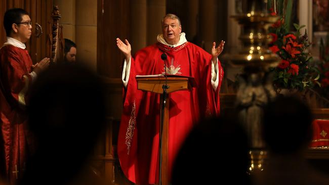 Archbishop Anthony Fisher overseeing Sunday mass under restricted Covid-19 conditions. Picture: Jane Dempster