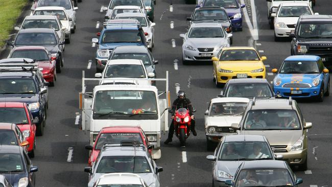 Motorists have been urged to stay off roads if possible after a second consecutive day of traffic chaos around Brisbane.