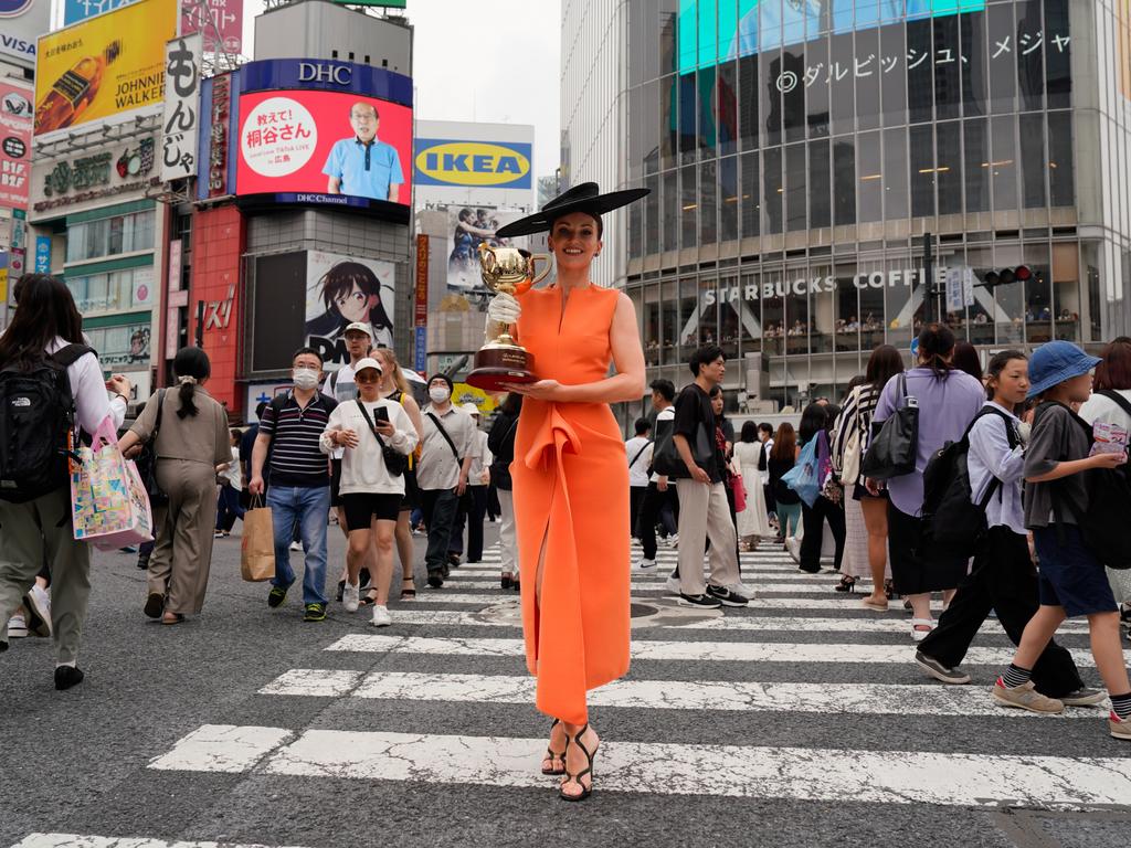 Tokyo, Japan: Bonnie Lane disrupts the crowd at Shibuya Crossing as part of the tour. Picture: Getty Images