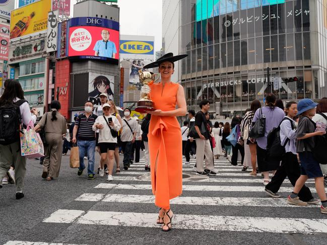 Tokyo, Japan: Bonnie Lane disrupts the crowd at Shibuya Crossing as part of the tour. Picture: Getty Images