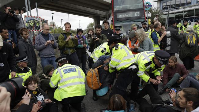 Extinction Rebellion climate change protesters block a road outside City Airport in London Picture: AP