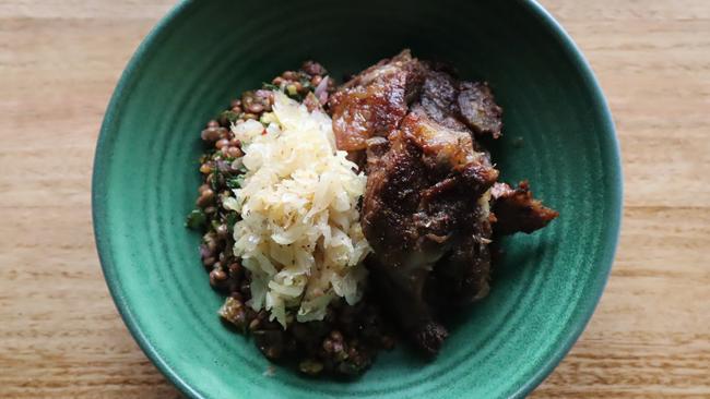 Country style lamb shoulder with red lentil and sauerkraut salad.