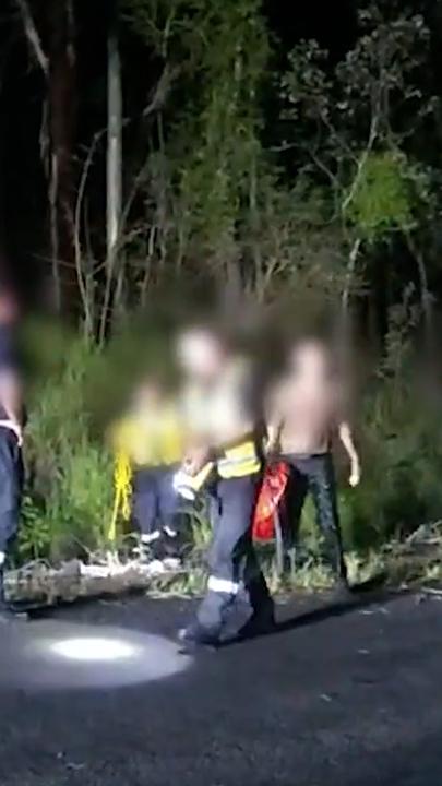 Trapped kids rescued from flooded Queensland river