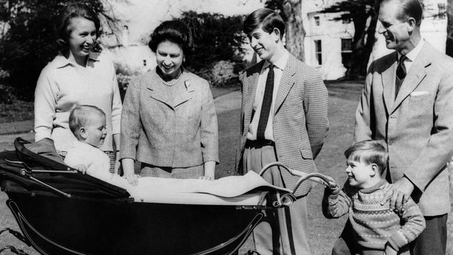 (The British Royal Family: Princess Anne, Britain's Queen Elizabeth II, Prince Charles, Prince of Wales, Prince Philip, Duke of Edinburgh, Prince Andrew, Duke of York smiling at Prince Edward, Earl of Wessex, in his cradle.