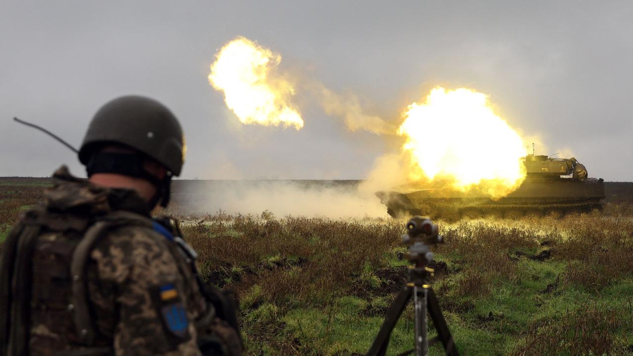 A Ukrainian soldier stands as a 2S1 Gvozdika self-propelled howitzer fires a shell on the front line in Donetsk region on October 10, 2022. Picture: AFP