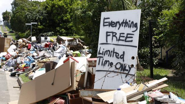 Rubbish stacked up in a Murwillumbah street after the floods. Picture: Jonathan Ng