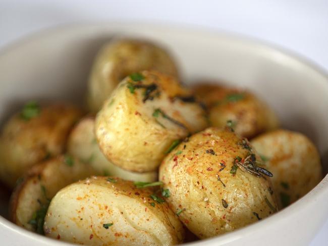 The Astor Grill’s duck-fat roasted baby potatoes. Picture: CHRIS KIDD