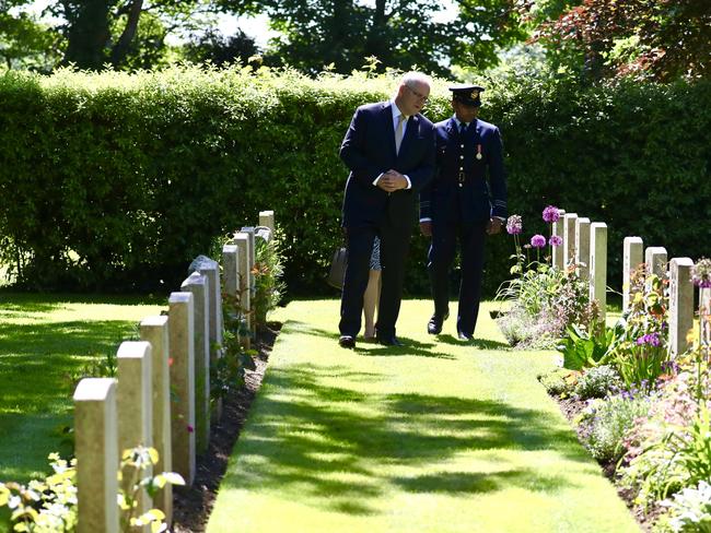 Australian Prime Minister Scott Morrison lays a wreath at the Cross of Sacrifice in remembrance of eight Royal Australian Air Force servicemen who died during World War II and are buried in St Illogan Churchyard in Cornwall. Picture: Adam Taylor/PMO