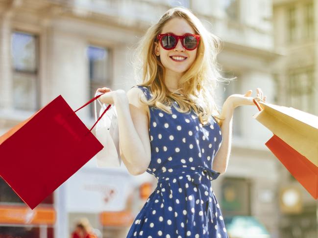 Beautiful, blonde woman is shopping in the city