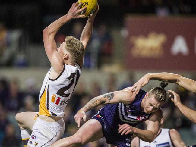 James Sicily takes a strong grab in front of Cam McCarthy. Picture: AAP