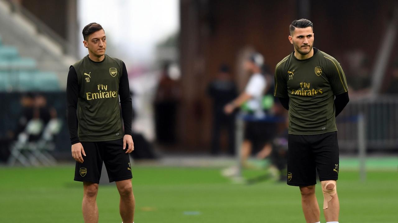 Arsenal duo Mesut Ozil (L) and Sead Kolasinac were the victims of a daylight armed robbery attempt.