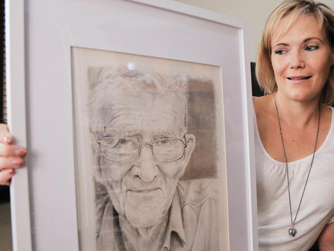 Julie Jones with a portrait of her late grandfather, Jack Samuel Wrigley. Picture: WSLHD