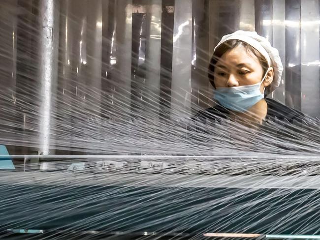 A worker in a Chinese textile factory ... Australia and the US say China has unfair trade advantages. Picture: AFP